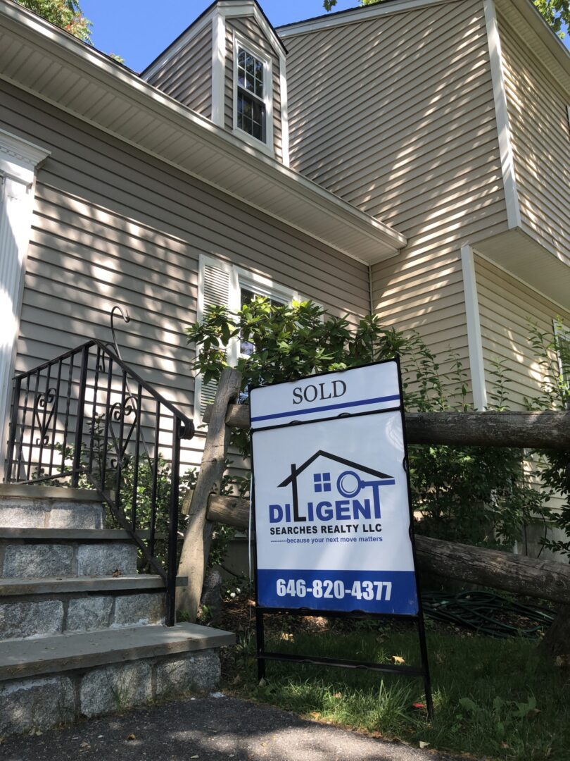 "Real estate sign indicating sold property."