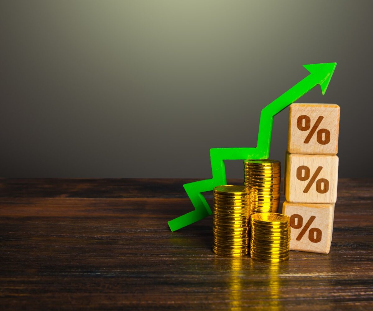 Graph showing growth with coins and percentages.